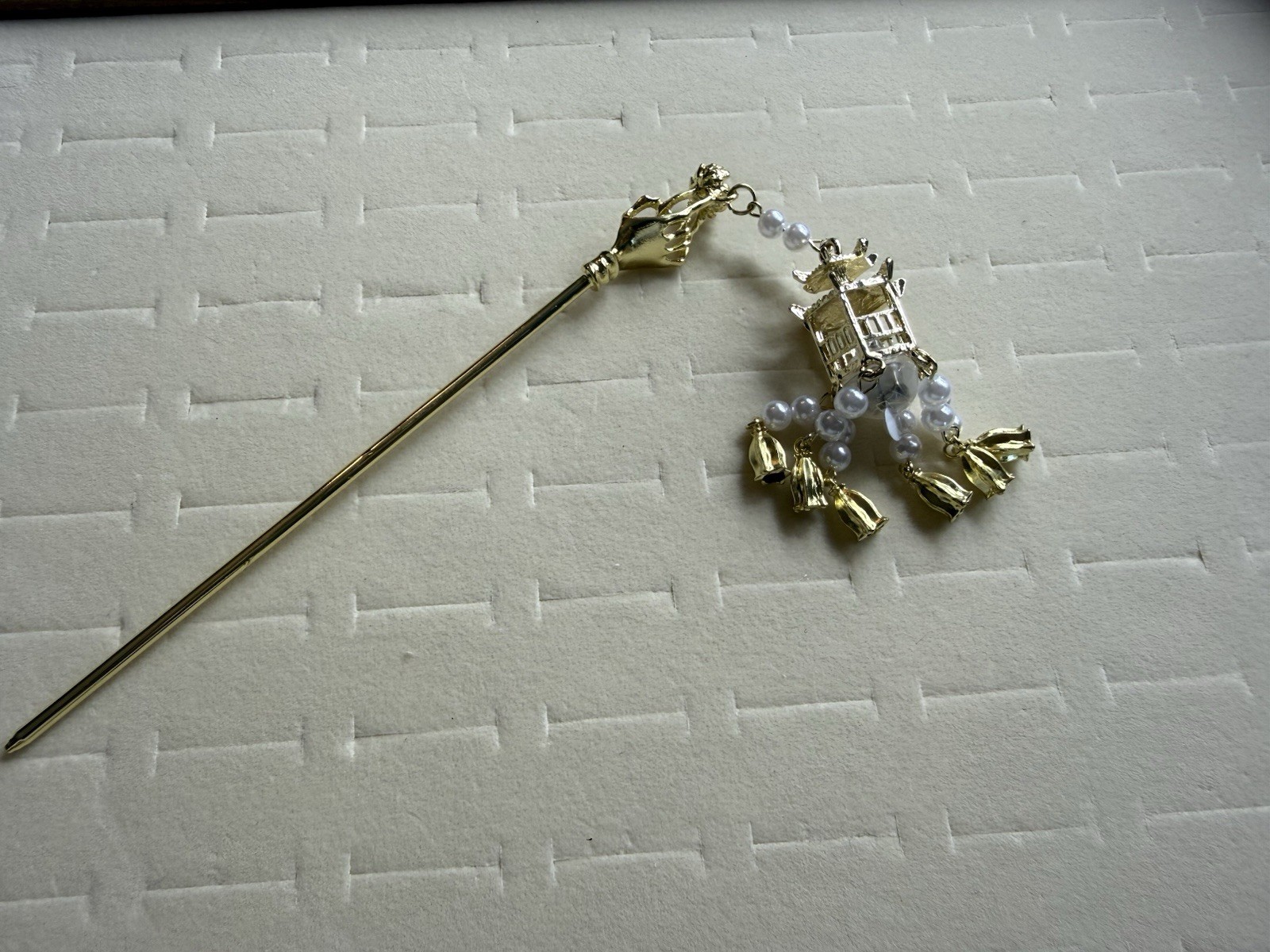 Luminous Gold Tone Hair Pin with Dangling Pagoda Charm & White Beaded Accents