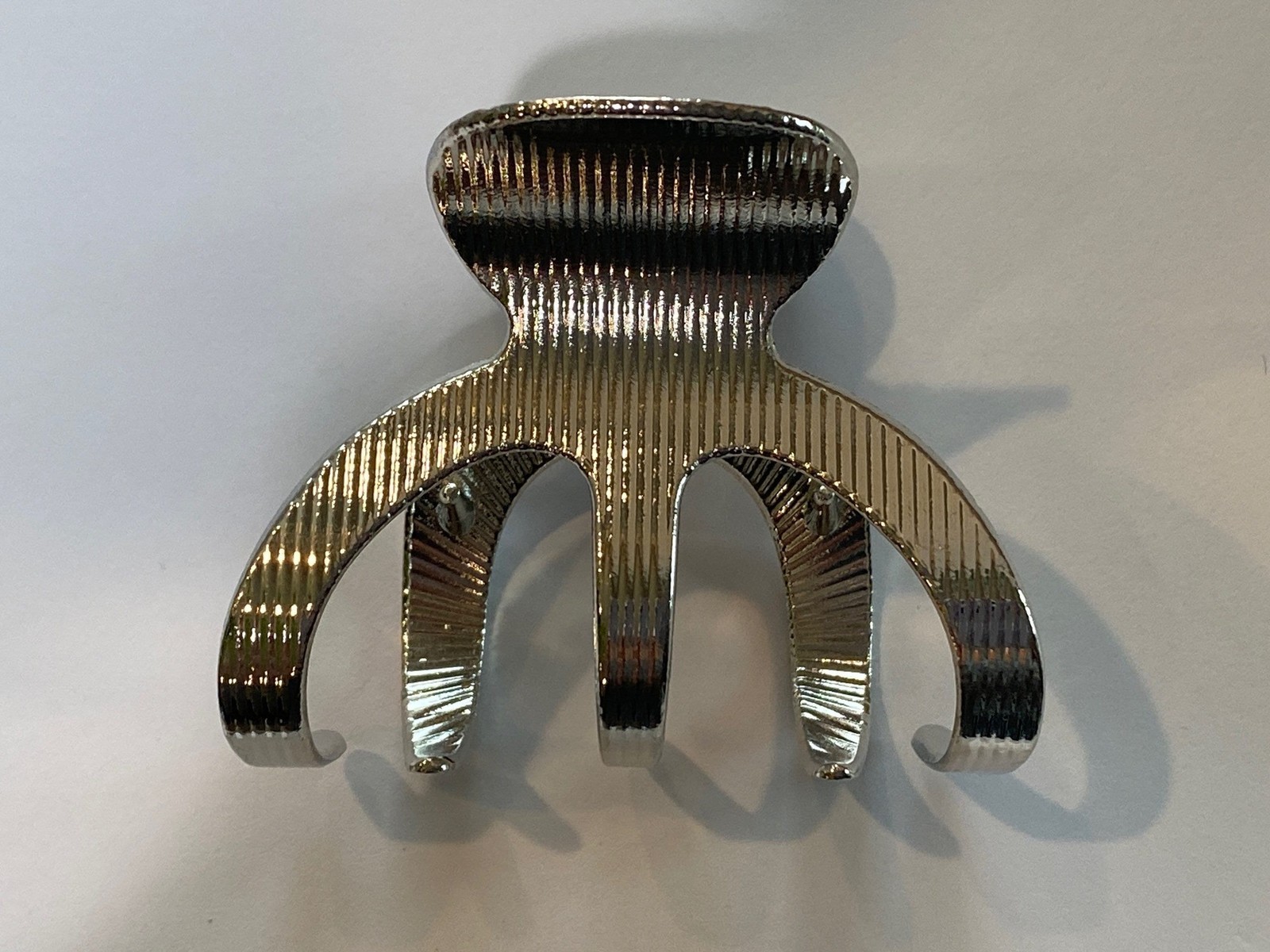 Medium shiny silver tone textured metal hair claw clip