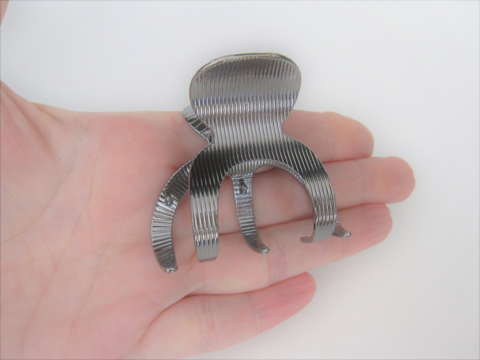 Medium shiny silver tone textured metal hair claw clip