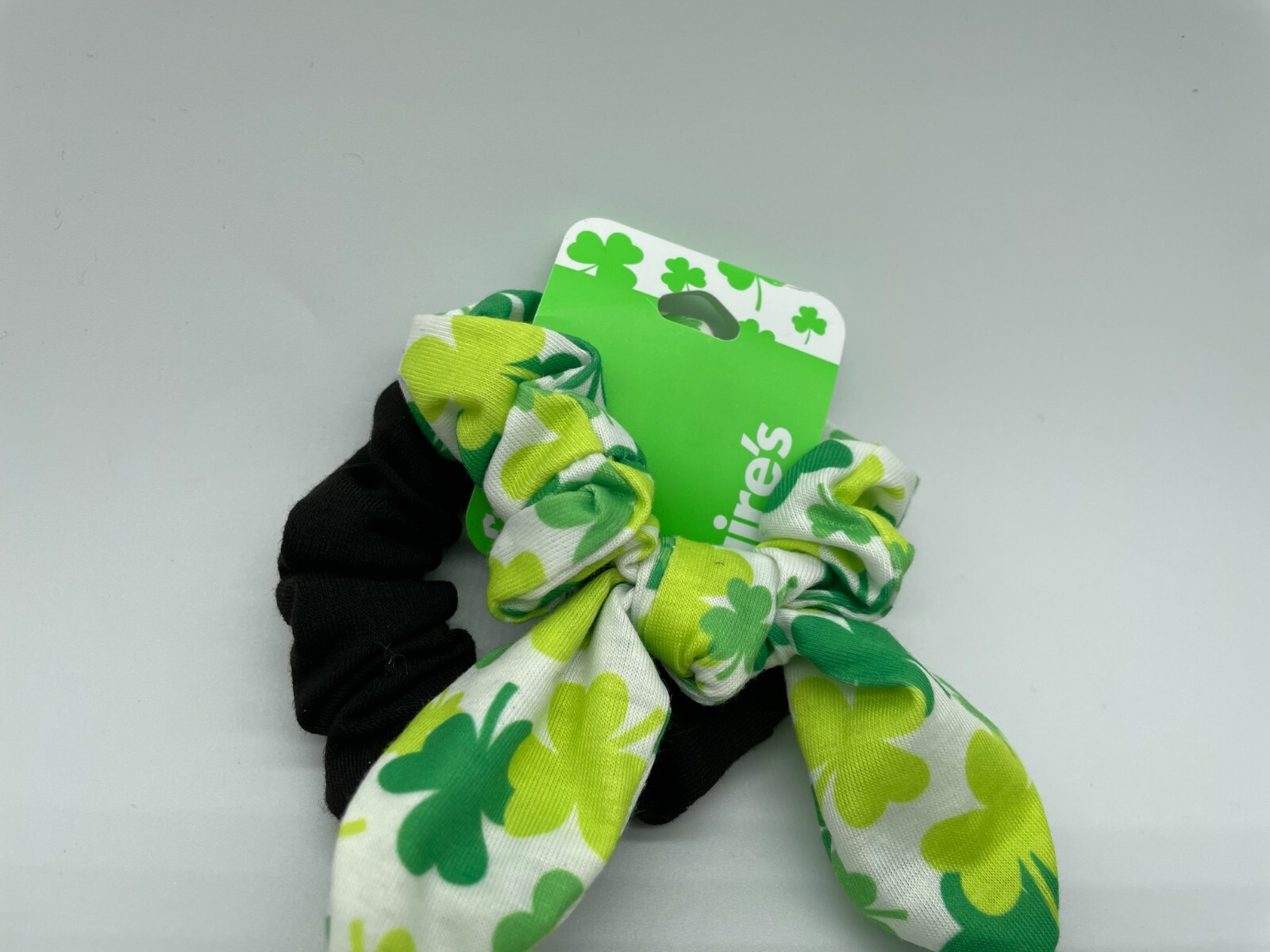 Girls Claire’s St Patrick’s Scrunchie One white with Clovers/one solid Black
